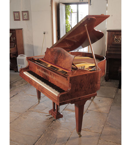 A 1936, Bechstein baby grand piano for sale with a figured, walnut case and square tapered legs