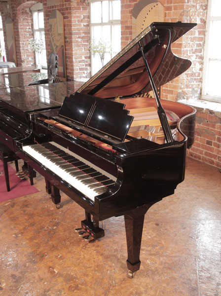 Art Deco style, 2002, Essex EGP160 baby  grand piano for sale in black gloss. Piano has an eighty-eight note keyboard and a three-pedal lyre.  