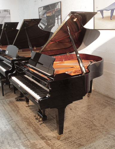 A 2016, Schimmel C189 Classic Series grand piano for sale with a black gloss case. Piano has an eighty-eight note keyboard and three-pedal lyre