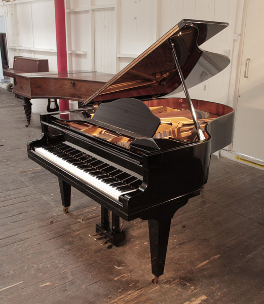 Reconditioned, 1985, Welmar grand piano for sale in black gloss. Piano has an eighty-eight note keyboard and a three-pedal lyre.  