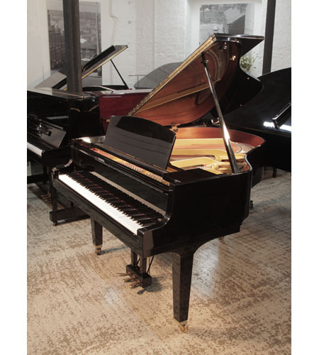 Reconditioned, 1992, Yamaha GH1 baby grand piano for sale with a black case and square, tapered legs. Made in Japan. Piano has an eighty-eight note keyboard and a three-pedal lyre. 