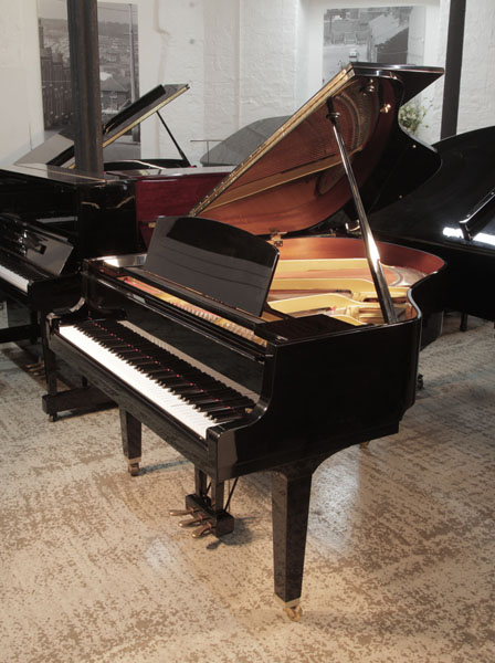 Reconditioned, 1992, Yamaha GH1 baby grand piano for sale with a black case and square, tapered legs. Piano has an eighty-eight note keyboard and a three-pedal lyre.
 